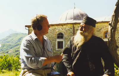 Michael Voss interviewing monk, Mt Athos behind