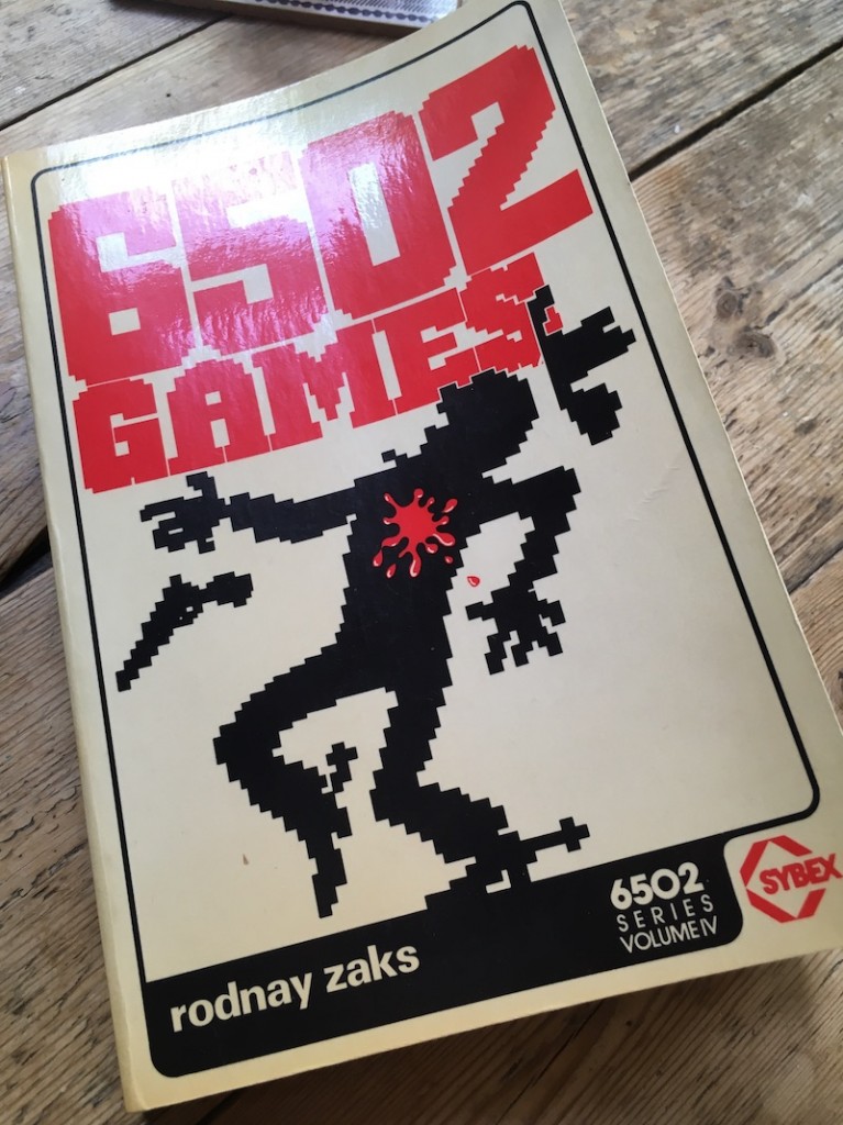 The cover of 6502 games, a bitmap style picture of a cowboy being shot.
